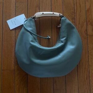 A new day small green purse